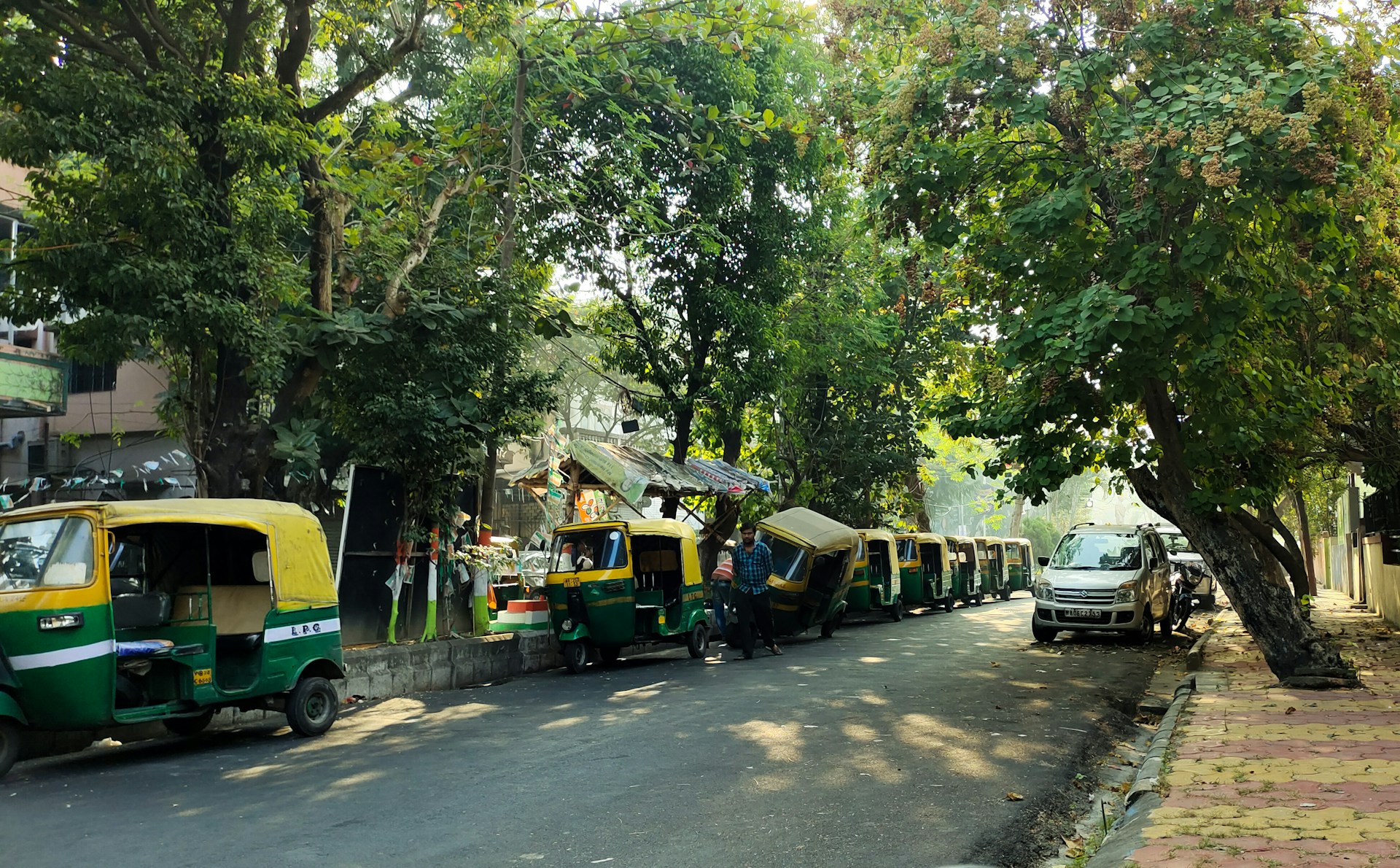 woman wearing yellow long-sleeved dress under white clouds and blue sky during daytime
