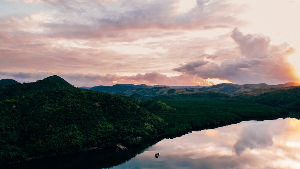 a body of water with hills around it