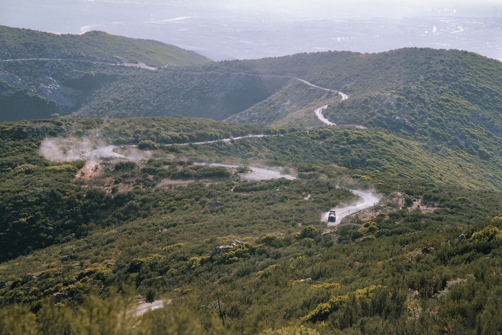 a winding road through a valley