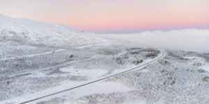 a road in a snowy landscape