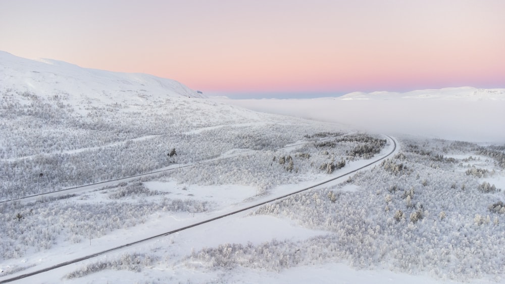 a road in a snowy landscape