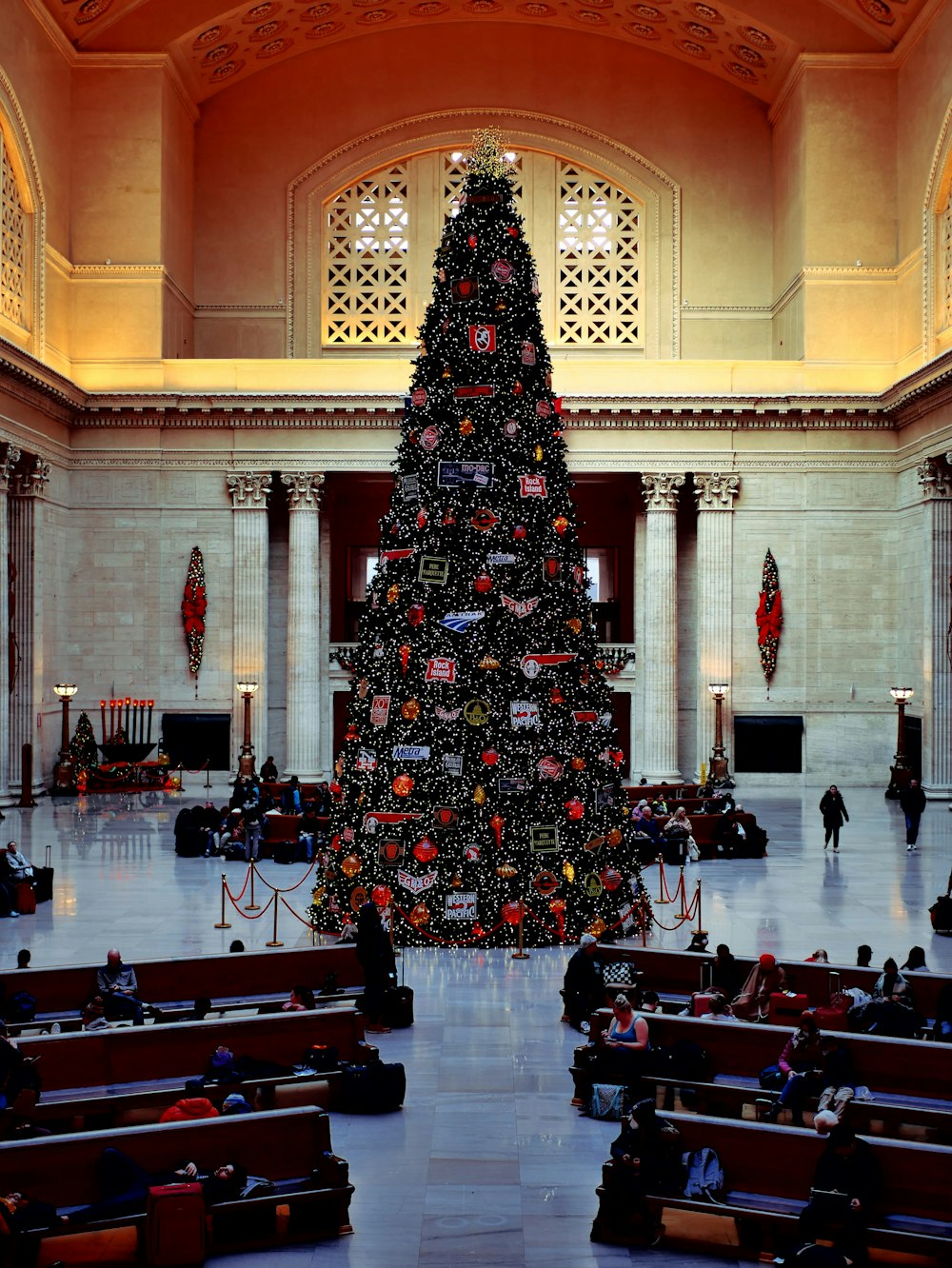 a large christmas tree in a church
