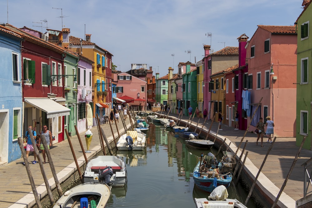 boats in a canal with Burano in the background