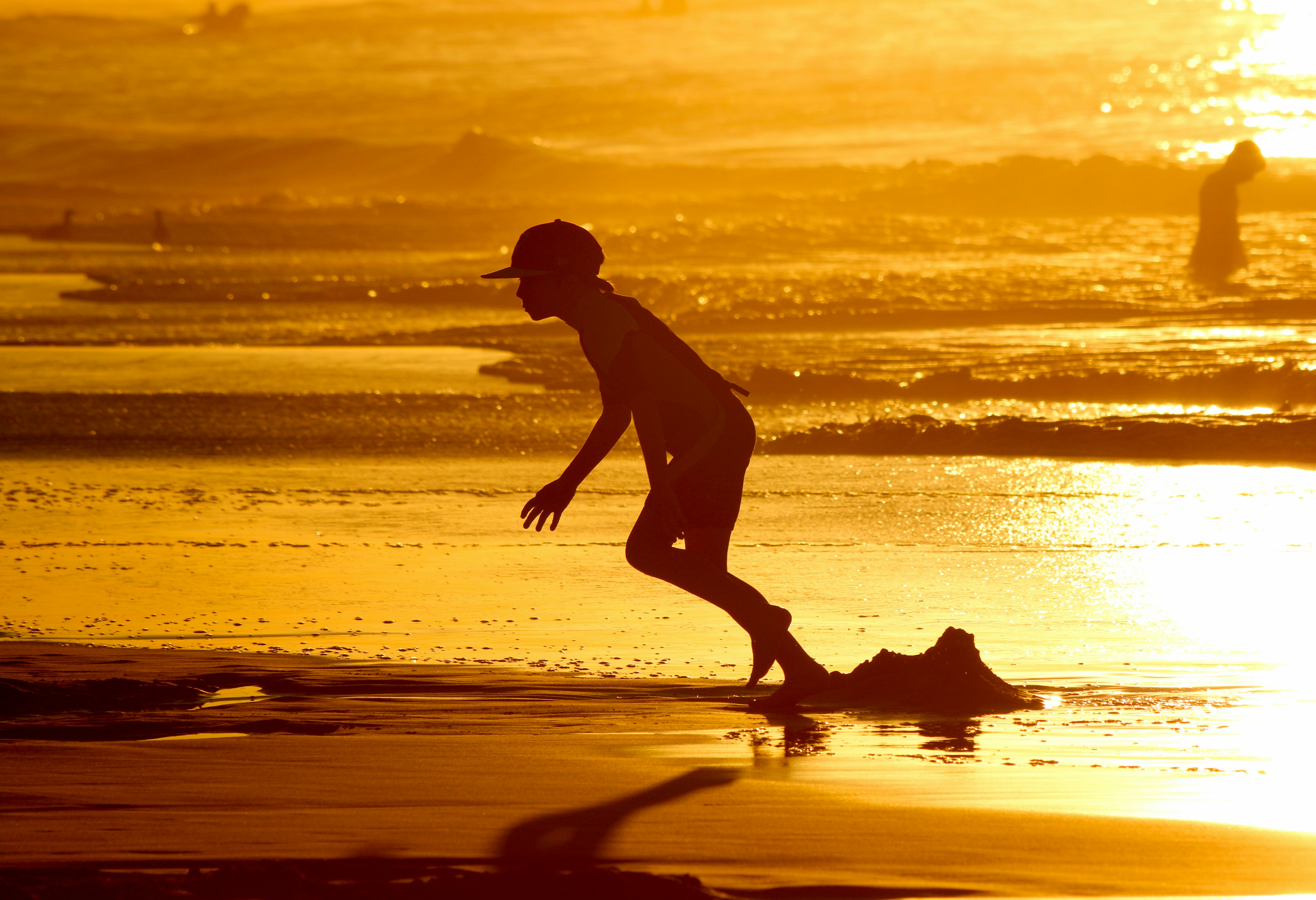 a man running on the beach