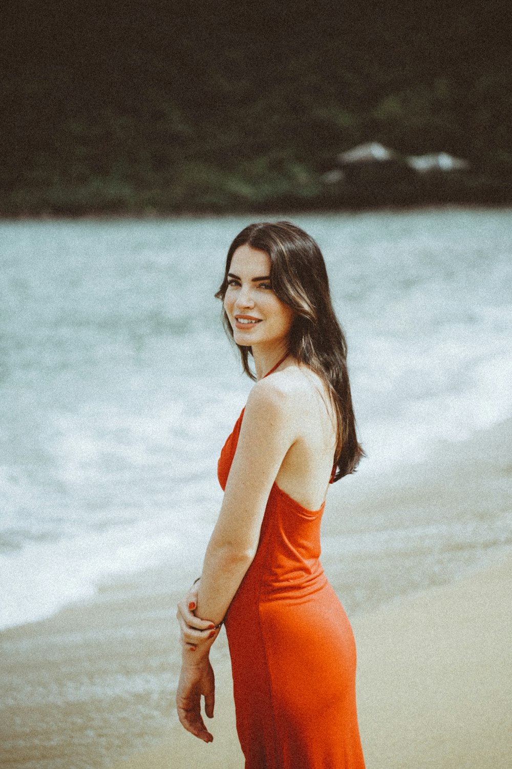 a woman in an orange dress