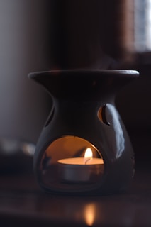 a candle in a mug