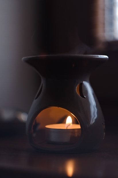 a candle in a mug