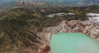 a body of water surrounded by mountains