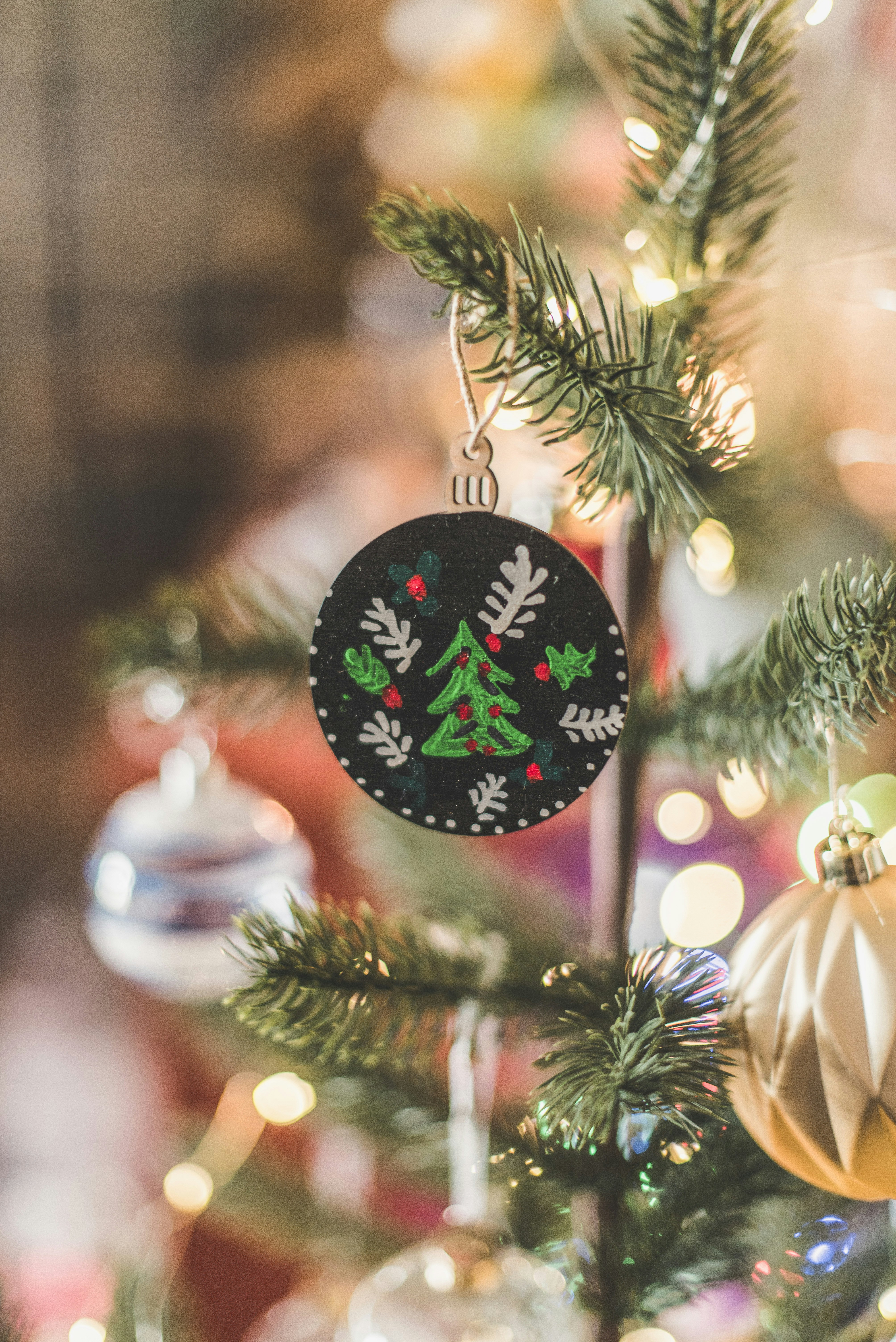 a decorated tree with a sign