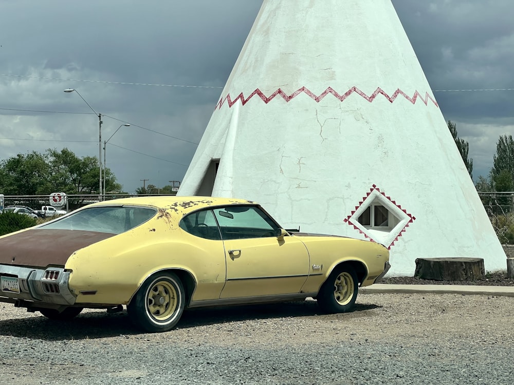 a car parked next to a white tent