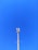 A cellular tower against a clear blue sky. The structure is tall and metallic with multiple antennas attached at the top.