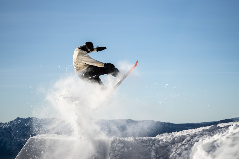 a snowboarder flies through the air