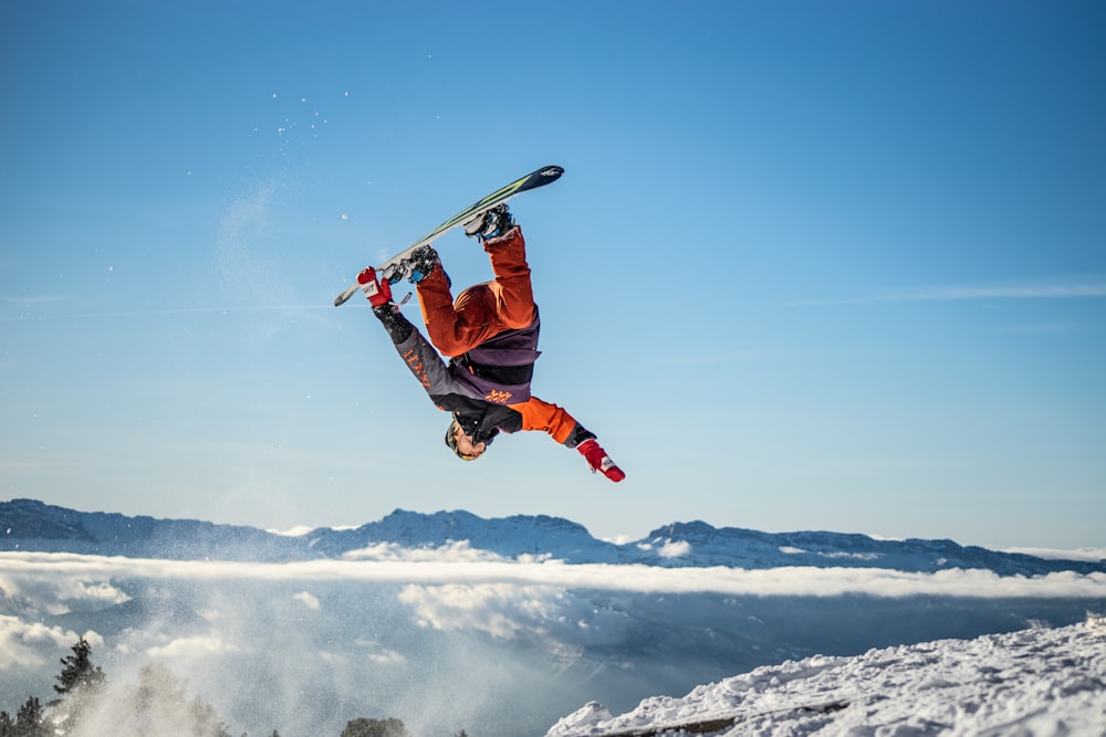 a snowboarder flies through the air