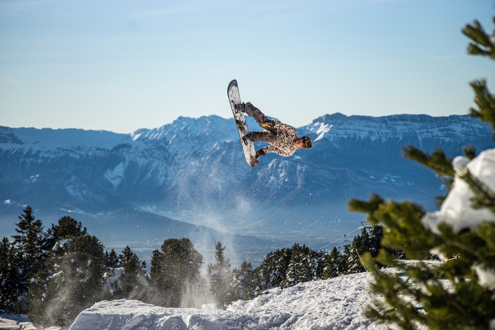 a snowboarder flies through the air