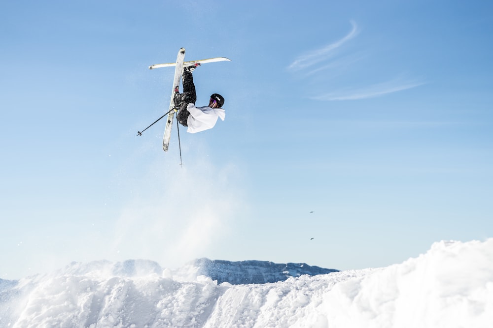 a person jumping in the air on skis