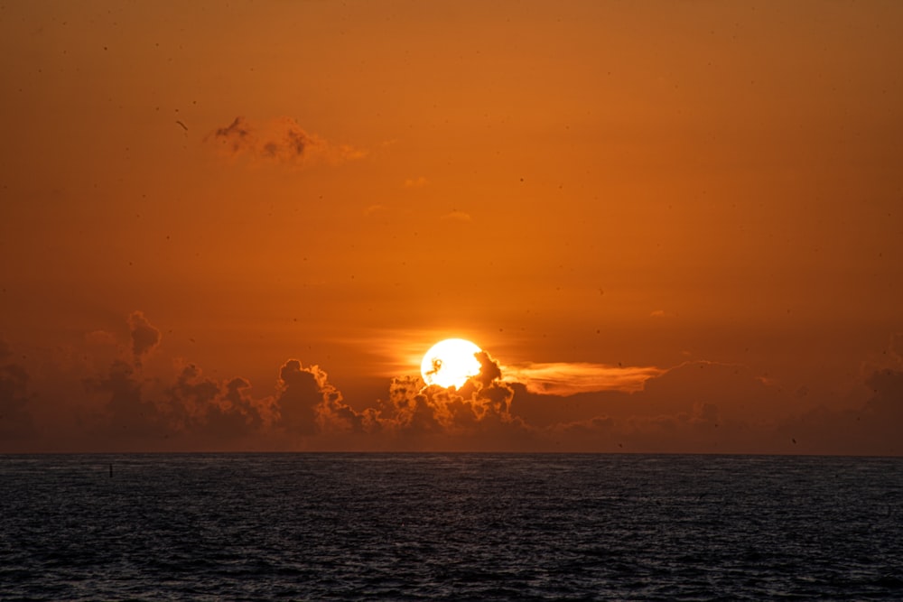 a sunset over a body of water