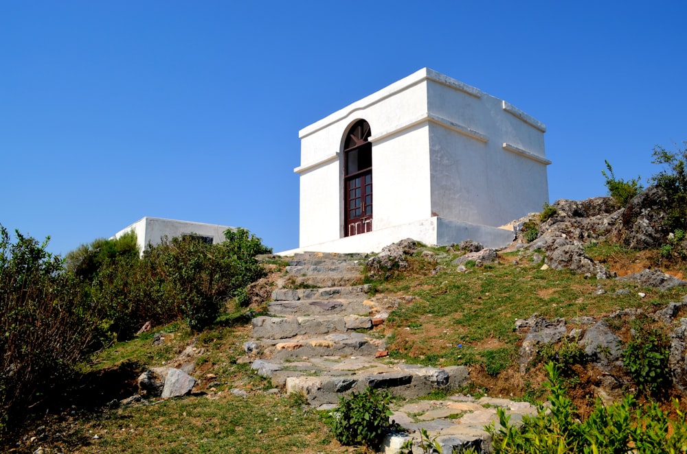 a white building on a hill