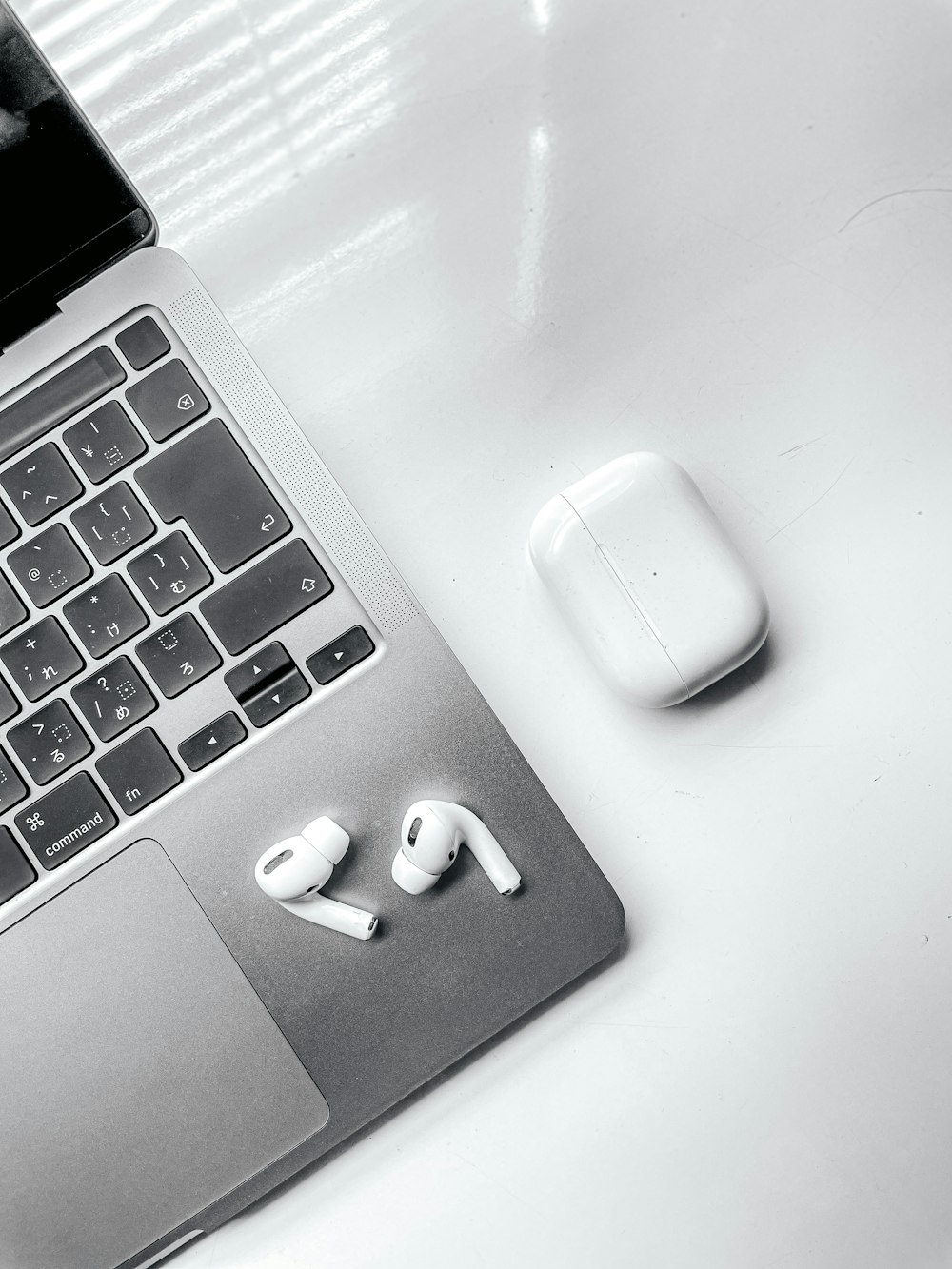 a laptop and a mouse on a table