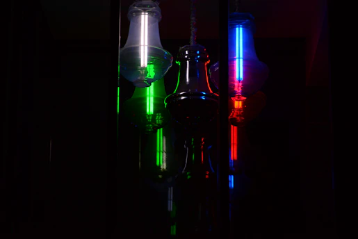 Elegant bottle service setup featuring sparkling bottles and glowing neon accents.