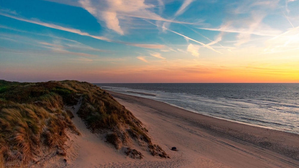 a beach with sand and water