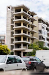 a building with cars parked in front