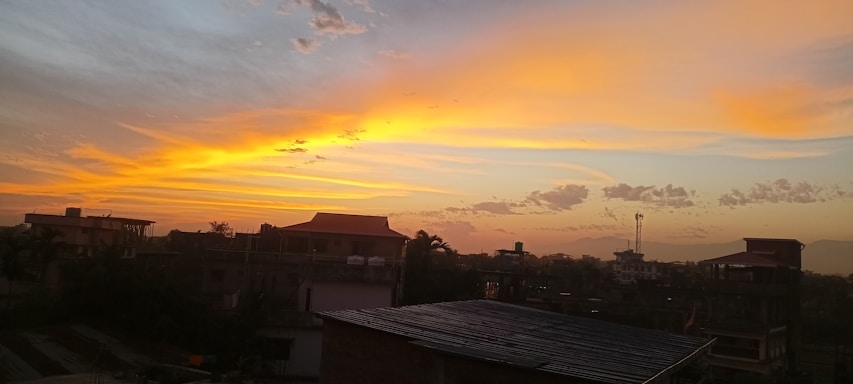 A warm sunset over a bustling travel agency office with vibrant orange and yellow tones.
