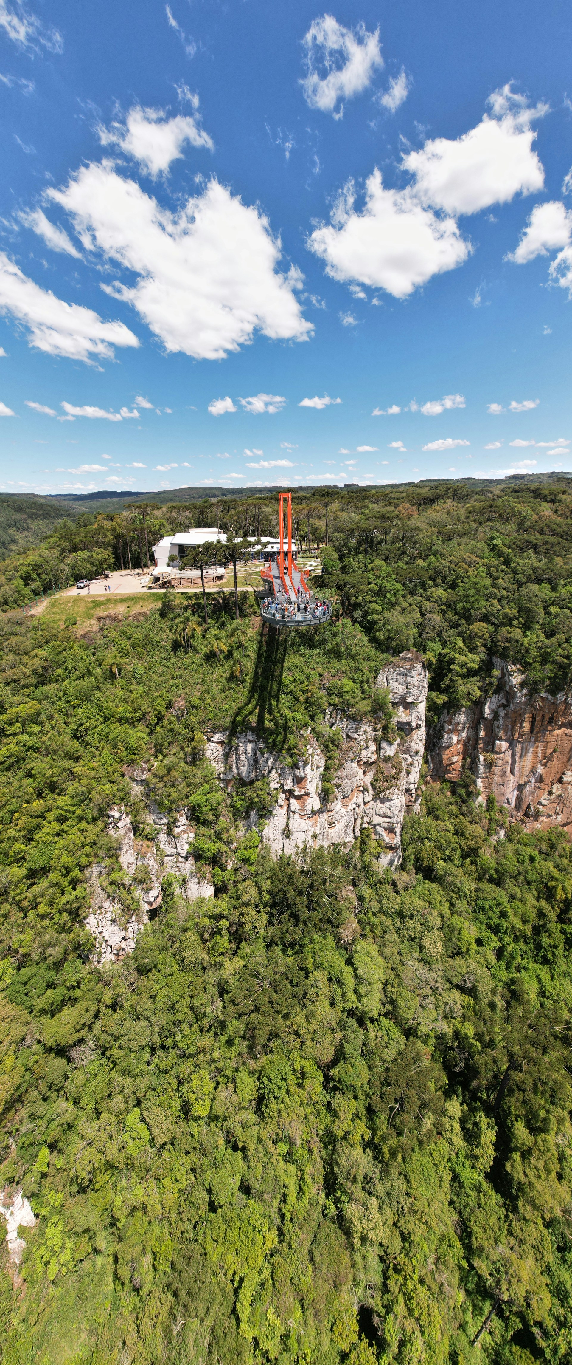 woman wearing yellow long-sleeved dress under white clouds and blue sky during daytime