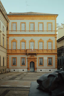 Historic European building facade blending tradition with contemporary investment.