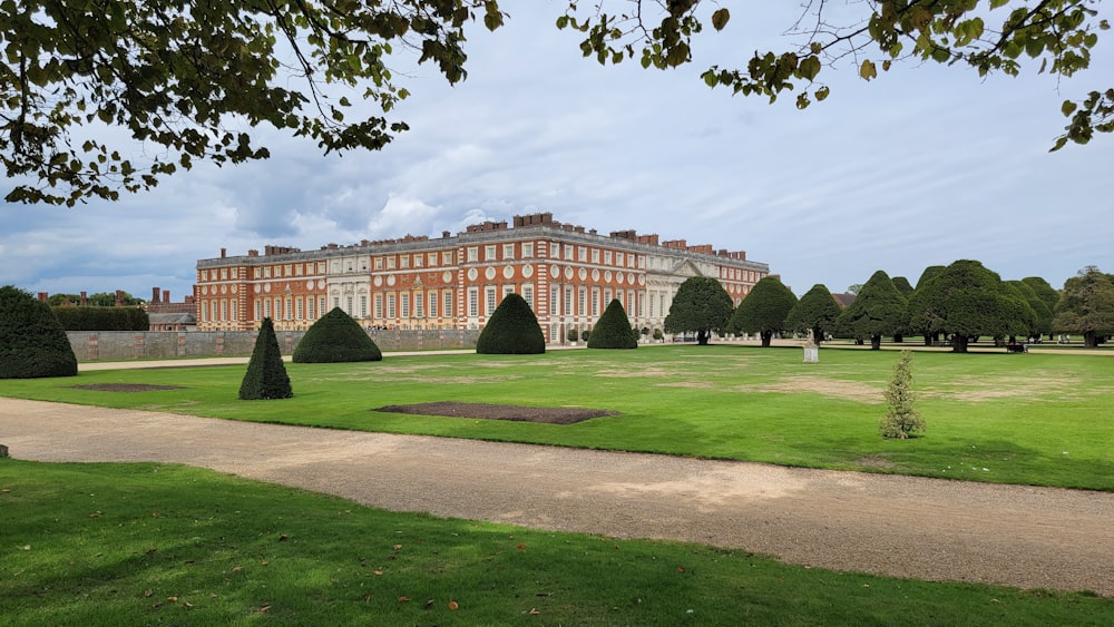 a large building with a lawn in front of it