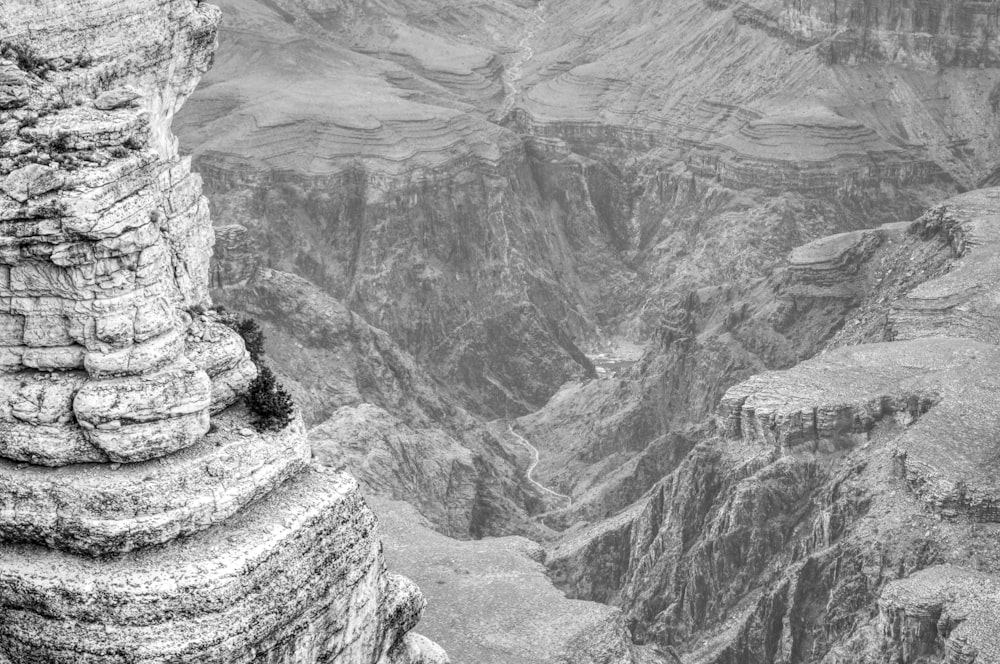 a rocky canyon with a river running through it