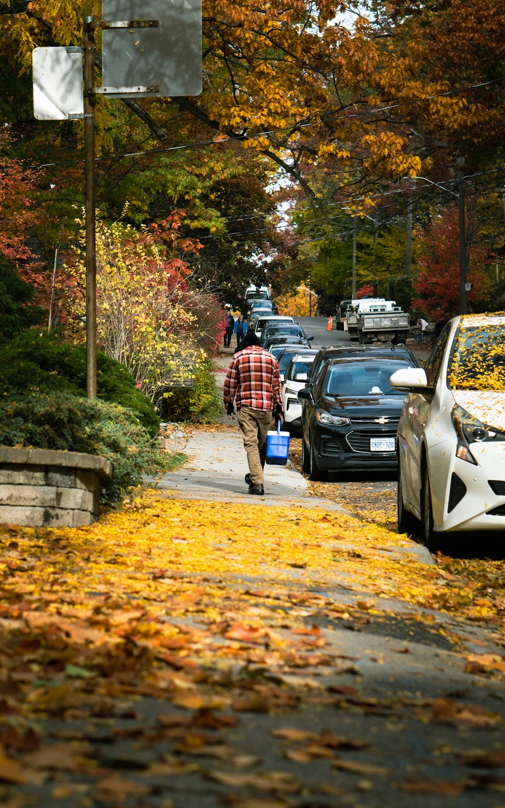 a man walking down a sidewalk