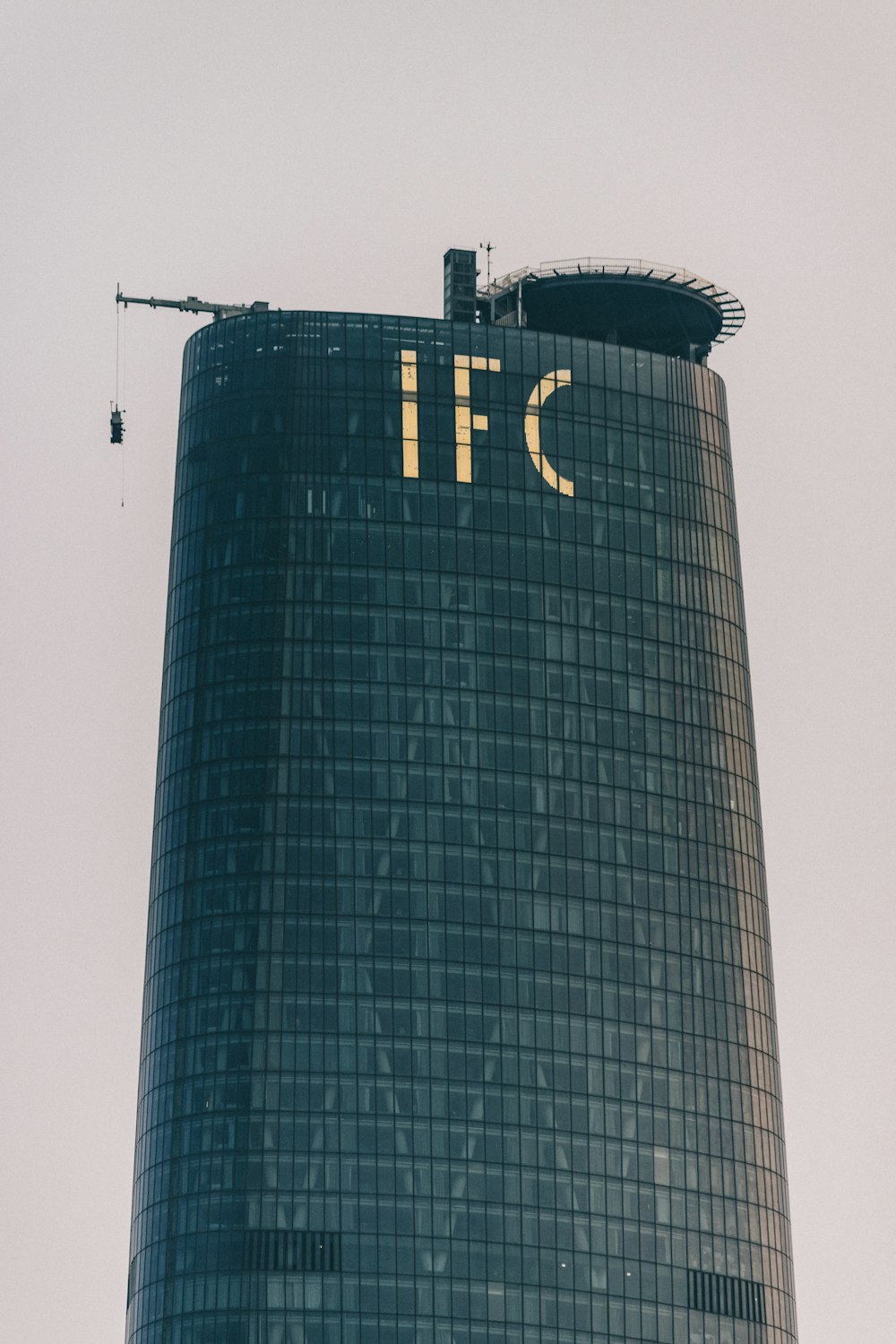 a tall building with a person standing on top