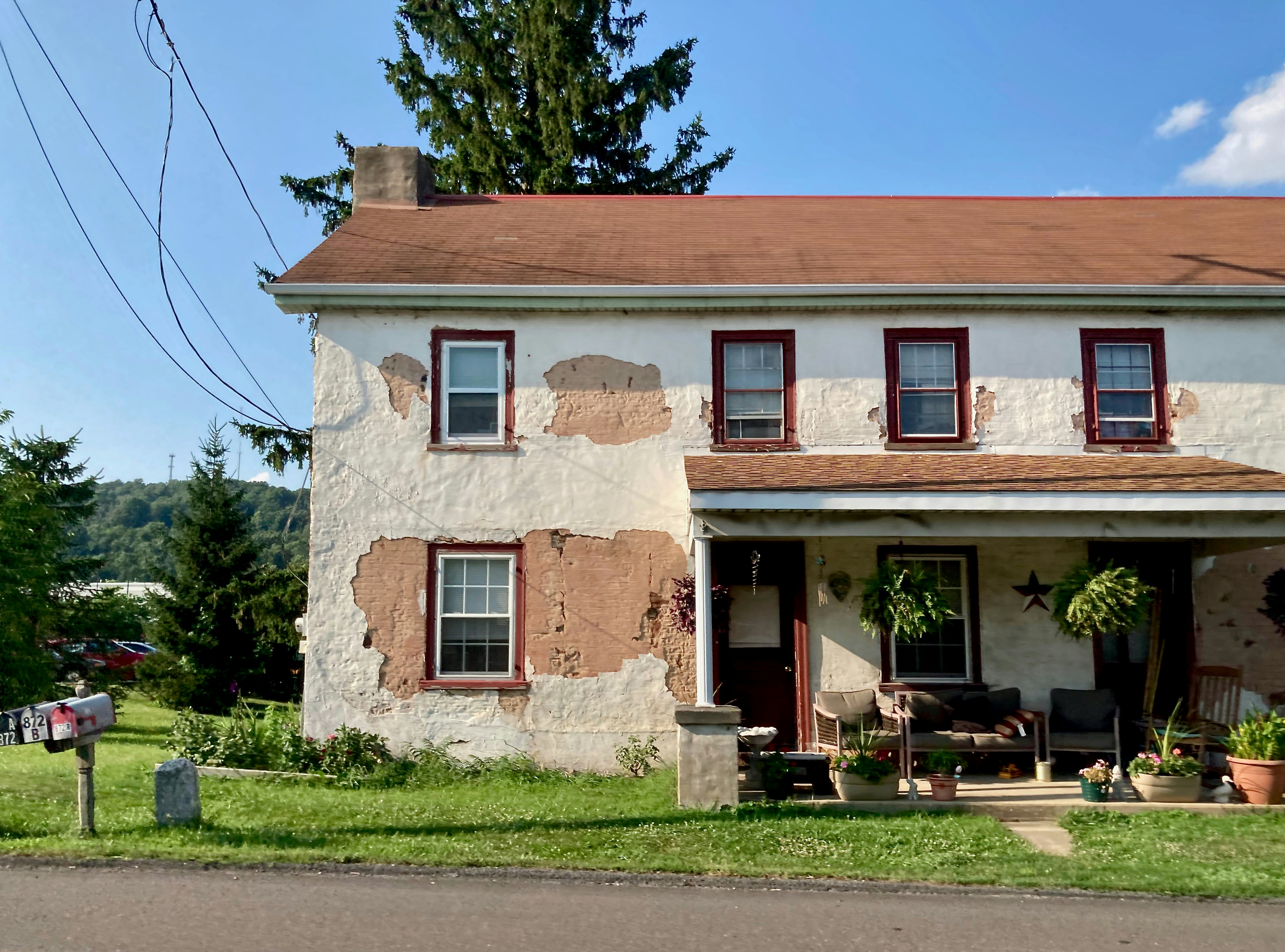 a house with a lawn and trees