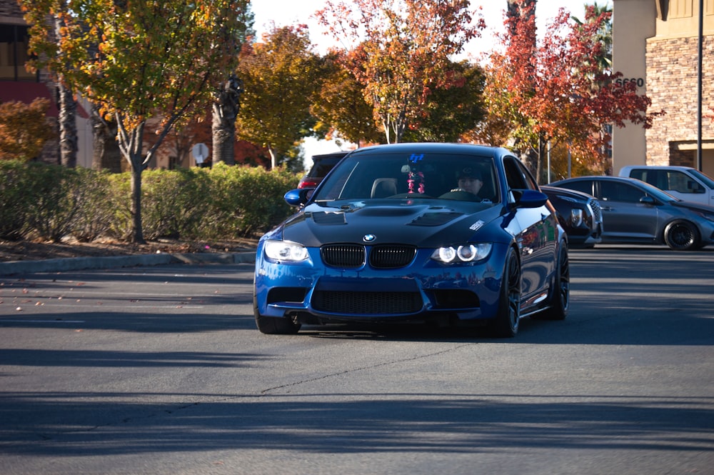 a blue car on a road