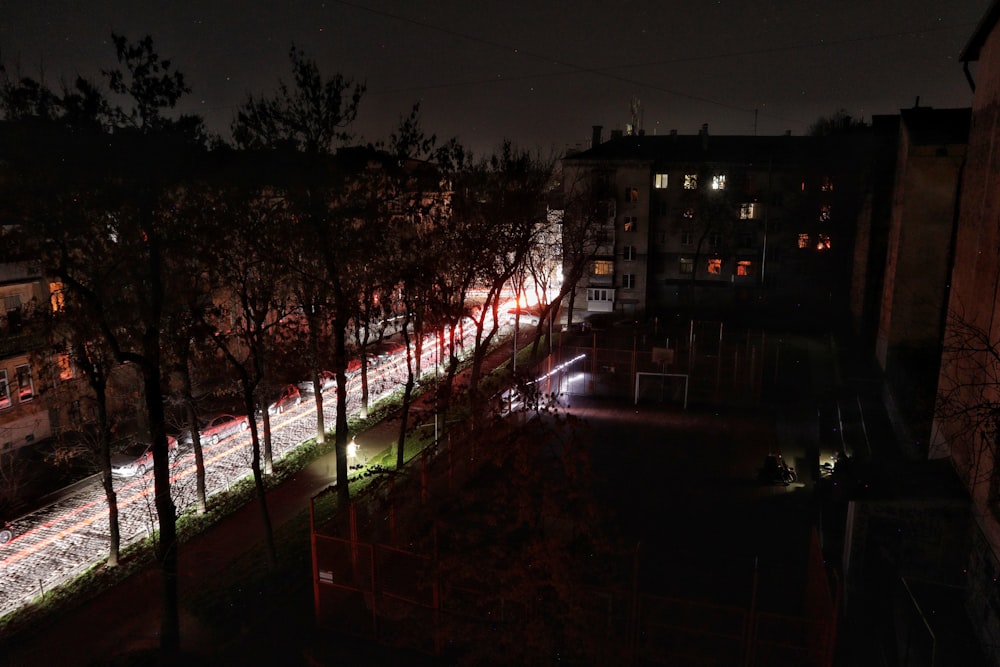 a building with trees in front of it at night