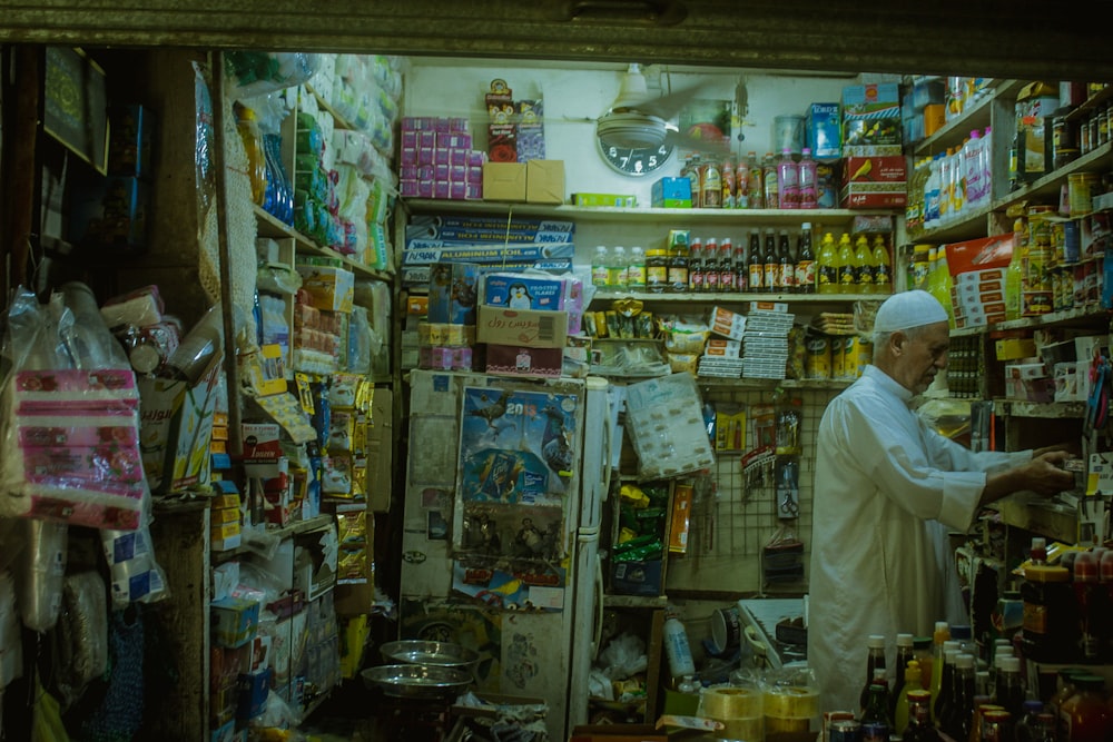 a man in a white robe in a store