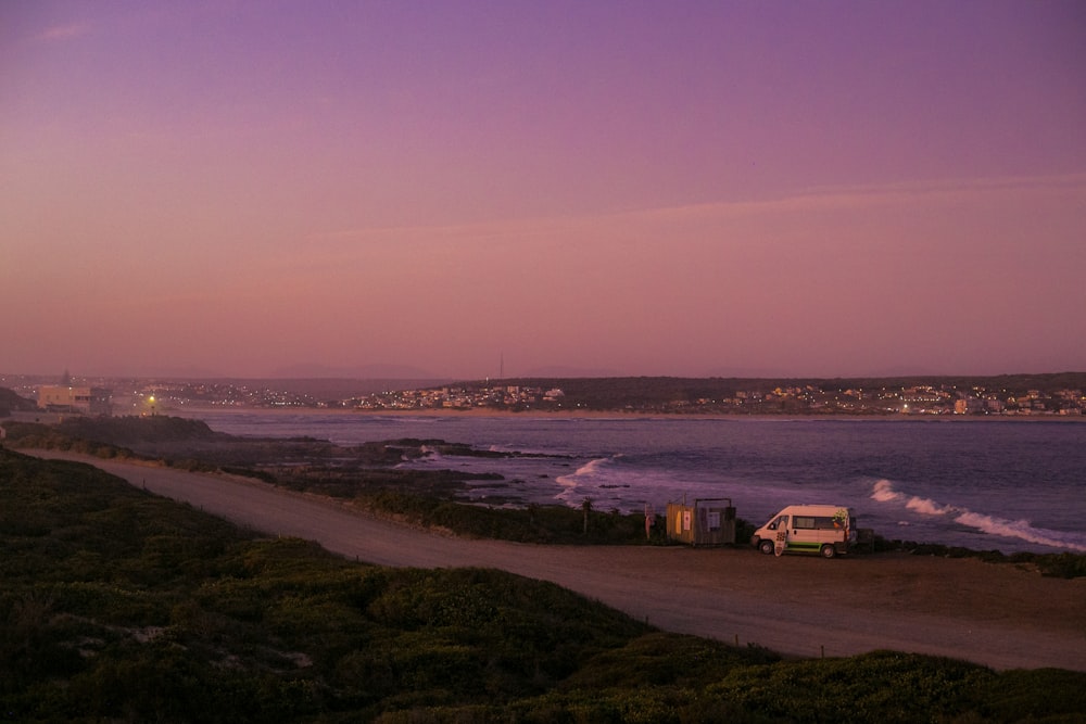 a beach with buildings and water