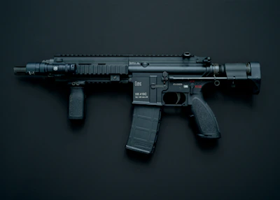 Close-up of a flashlight attached to a firearm rail, casting a bright beam in a dark setting.