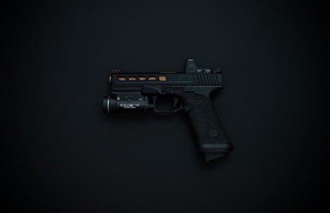 A black handgun with detailing and an attached flashlight is displayed against a dark background.