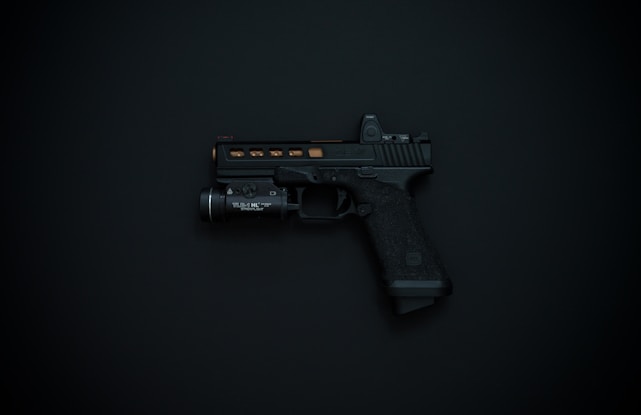 A sleek and powerful 44 Automag pistol displayed on a dark background.