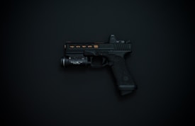 A black handgun with detailing and an attached flashlight is displayed against a dark background.