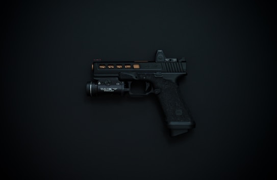 A black handgun with detailing and an attached flashlight is displayed against a dark background.