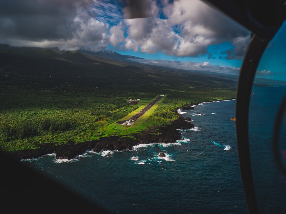 an aerial view of a green island