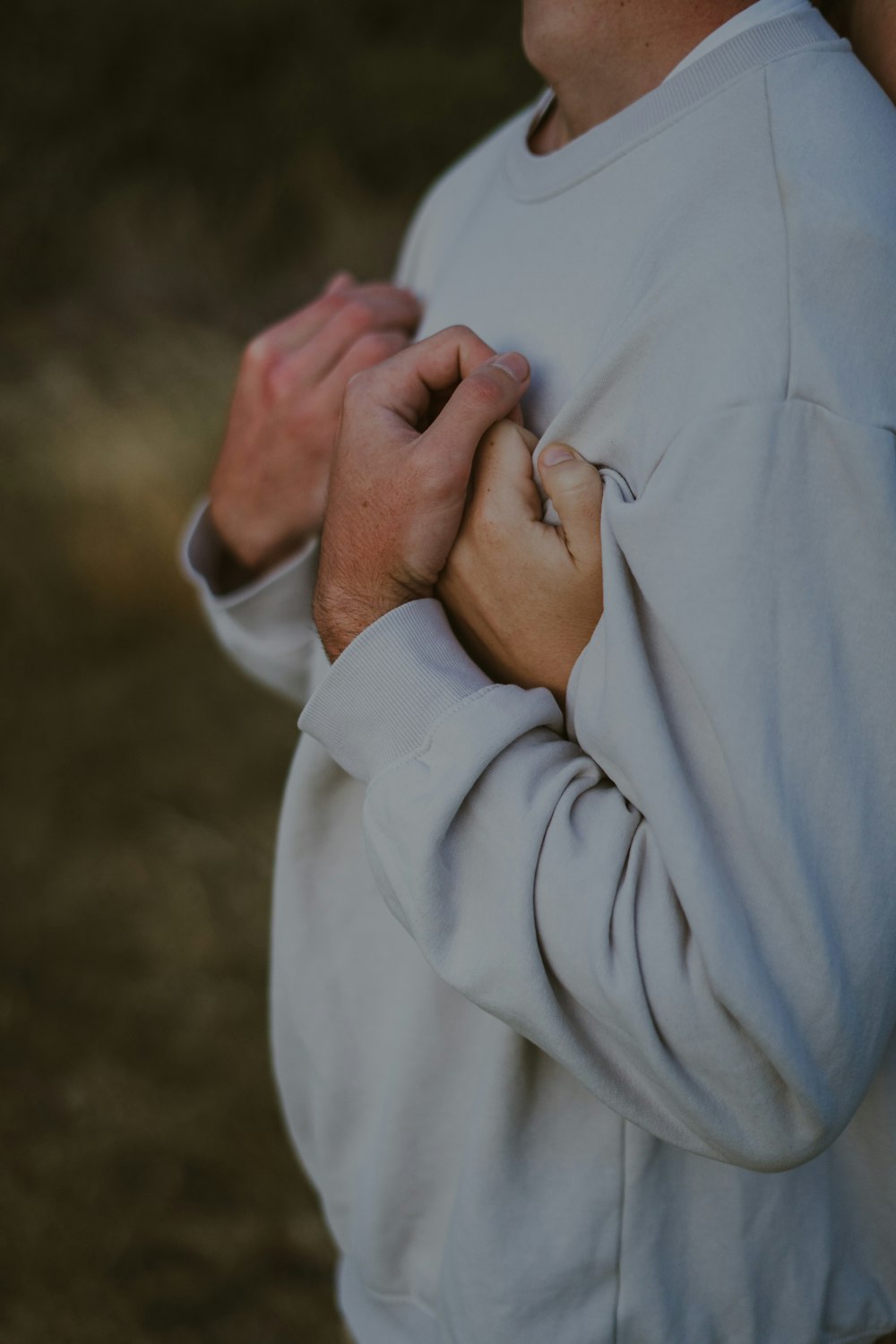 a man holding his hands together