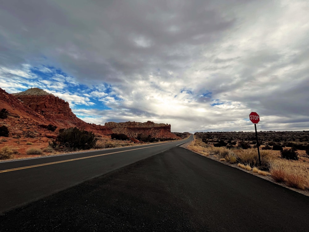 a road with a stop sign on the side