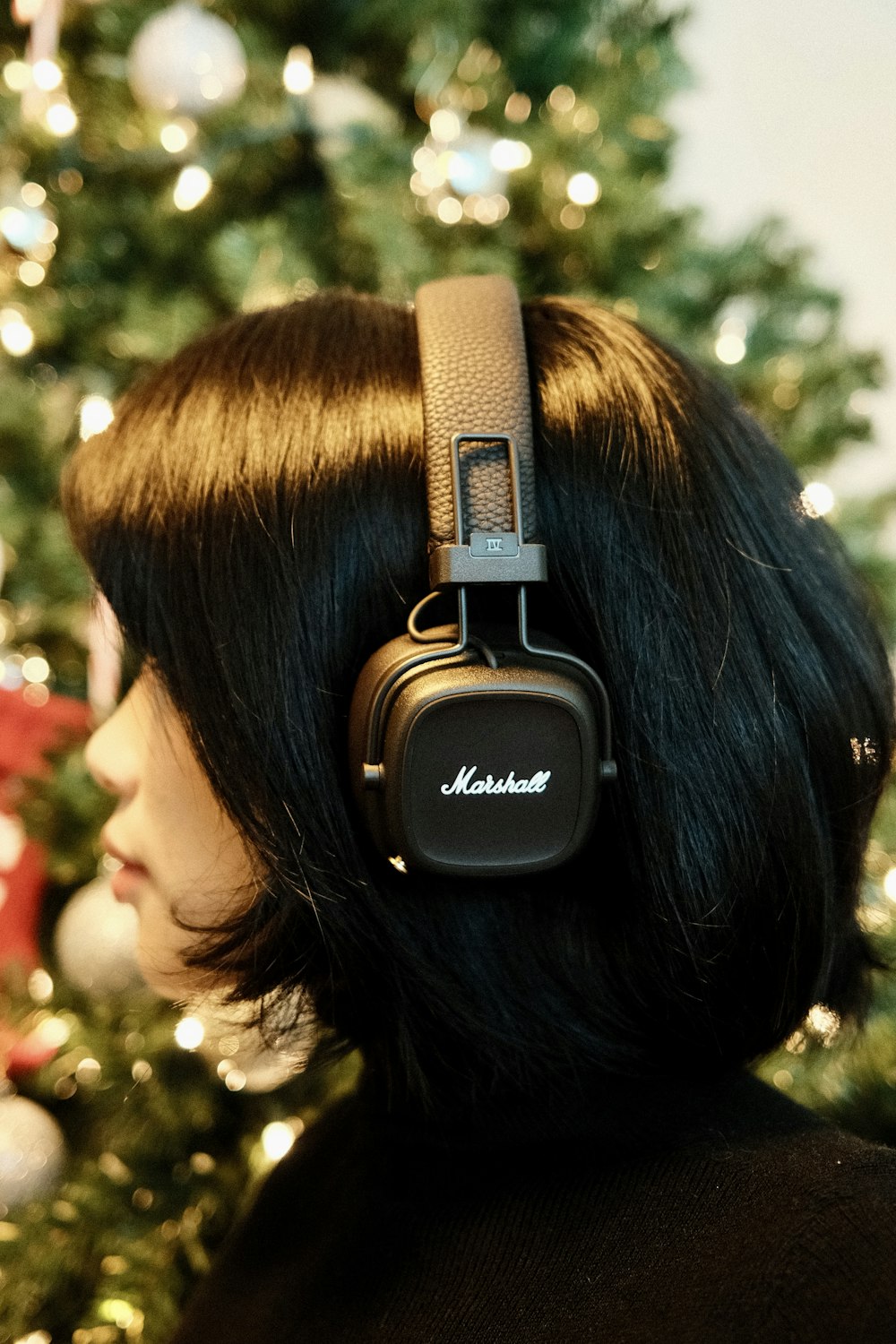 a woman wearing a black headphone