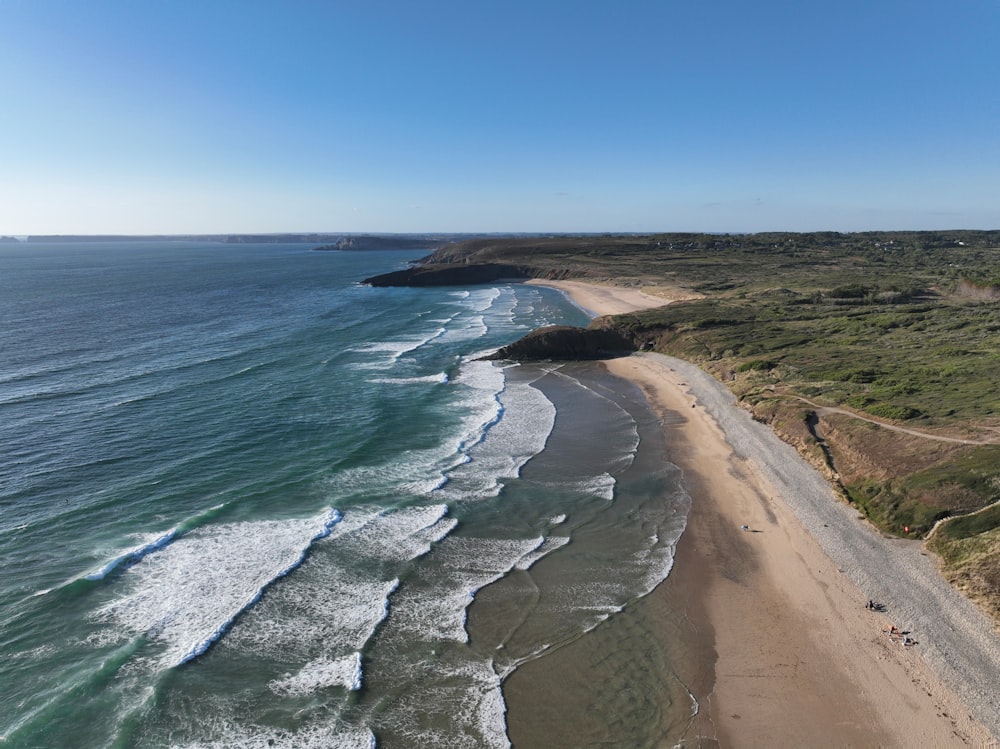 a beach with a body of water