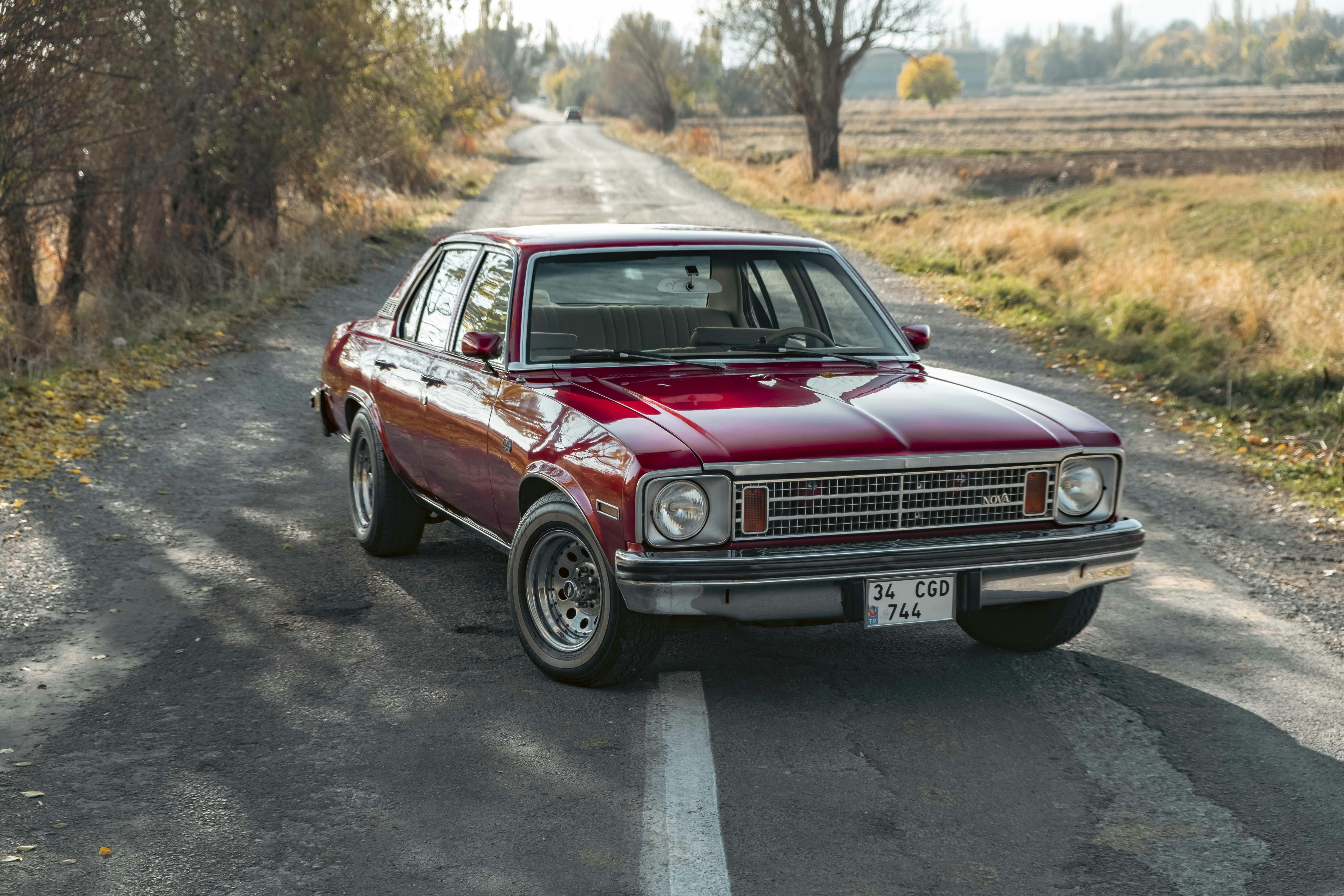 A red car on a road photo Free Kayseri Image on Unsplash