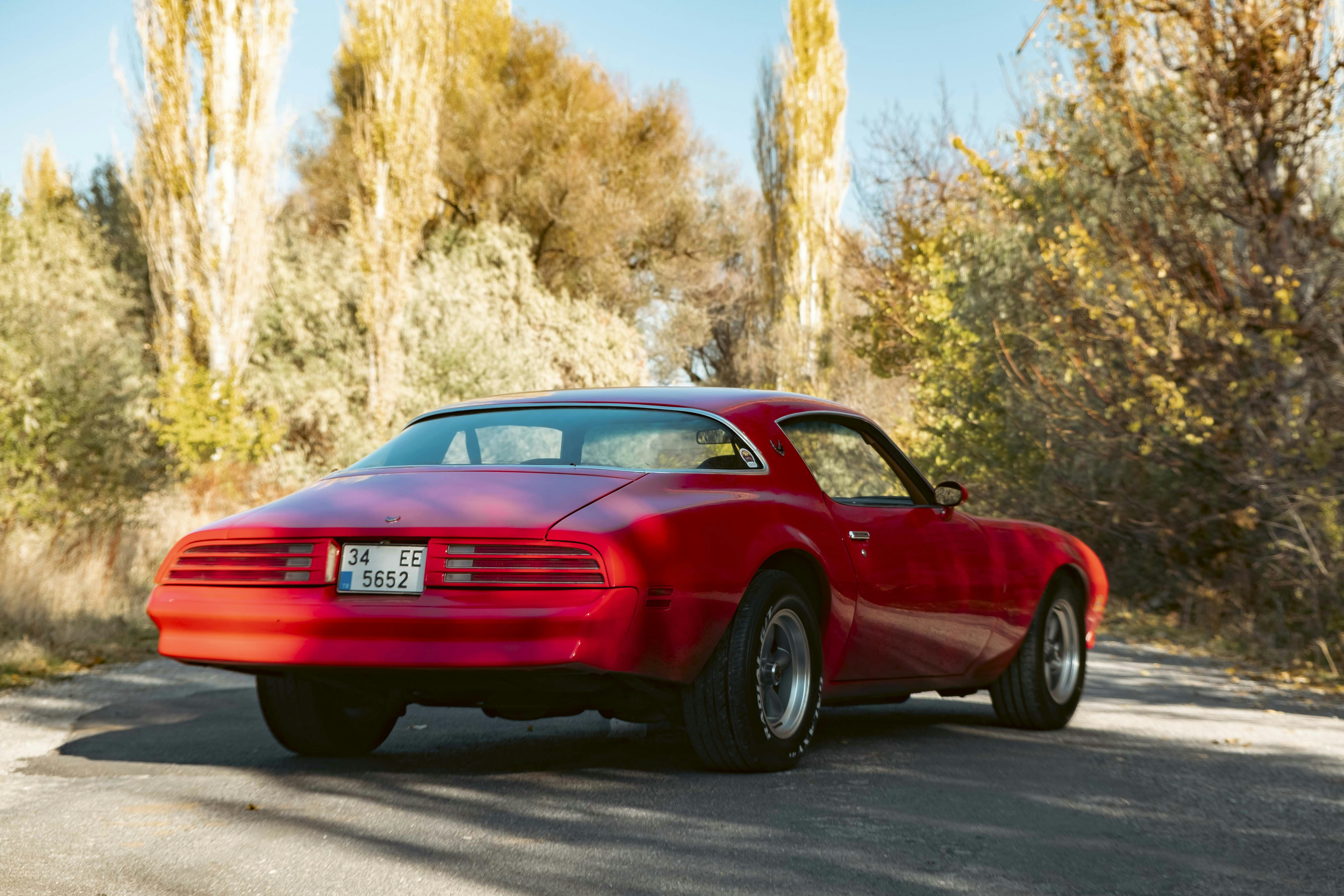 A red car on a road photo Free Kayseri Image on Unsplash