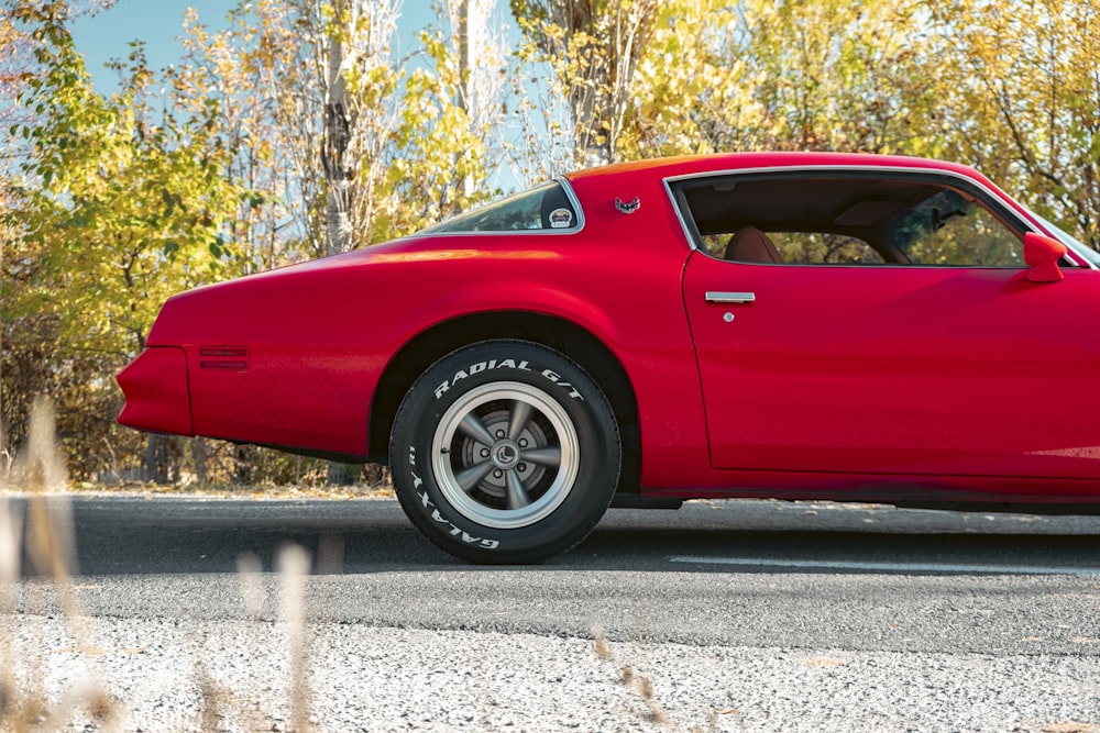 a red car parked on a road